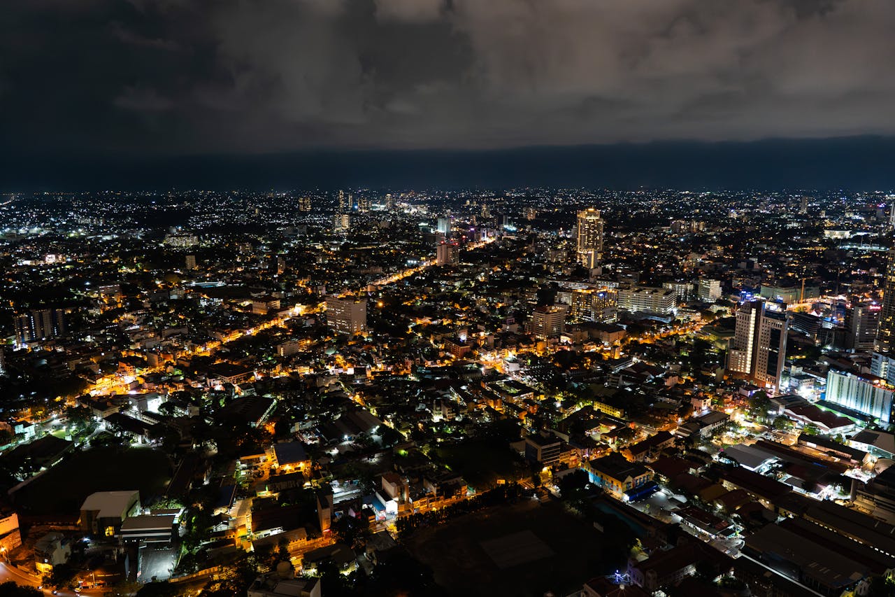 Stunning aerial nightscape of Colombo, Sri Lanka, showcasing illuminated city streets and skyline.