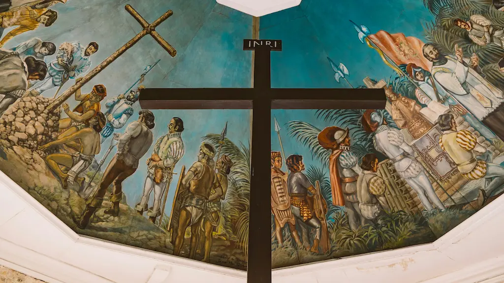 Visiting Magellan's Cross to admire its vibrant ceiling mural depicting the arrival of Christianity is one of the most memorable things to do in Cebu.